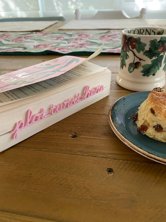 pink bookmark with fruit scone and a cup of tea